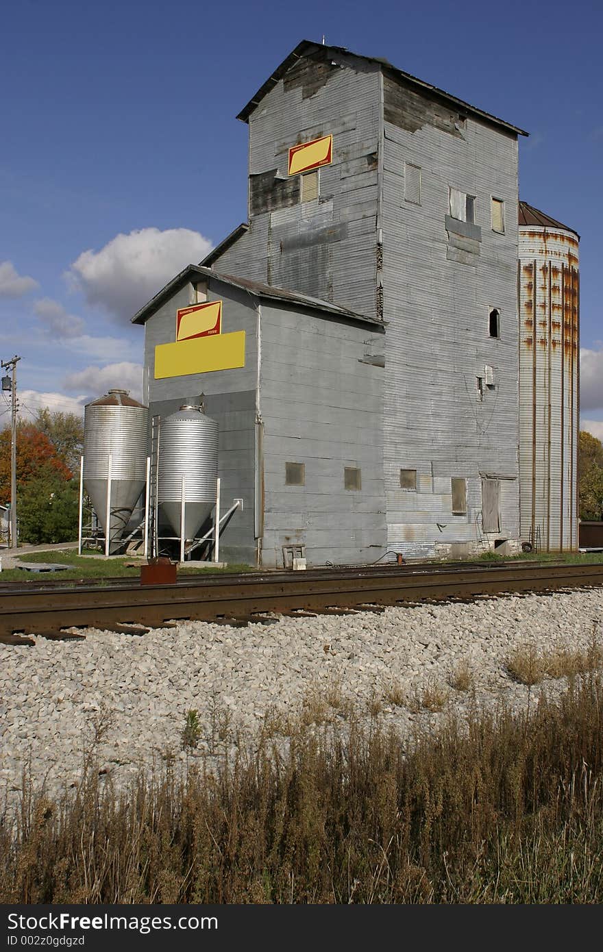 Rural Grain Elevator by railroad tracks