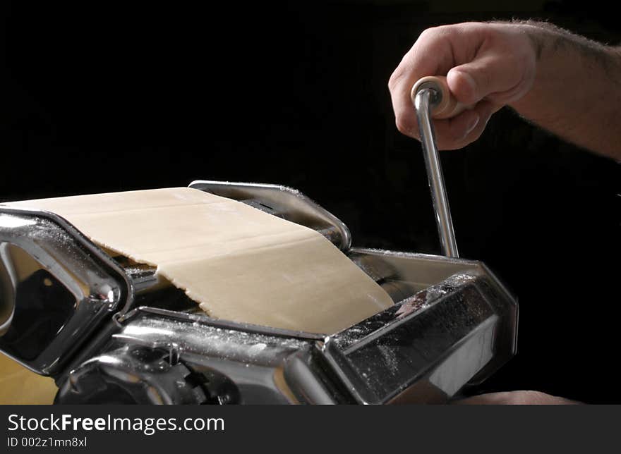 Cranking pasta machine. Cranking pasta machine