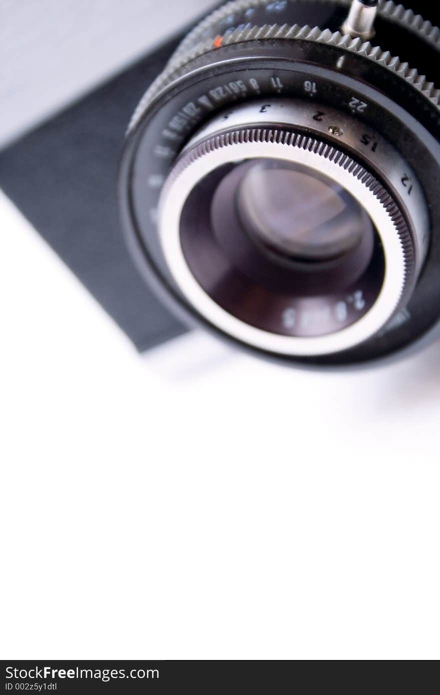 Vintage camera lens isolated on white background - shallow DOF