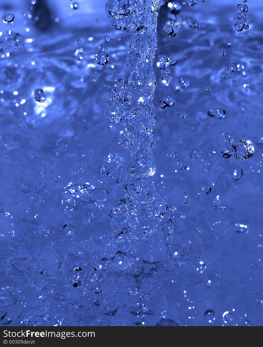 Water flow captured on impact with the still water surface