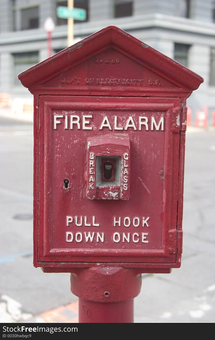 A public sidewalk fire alarm that looks like it's seen some use. A public sidewalk fire alarm that looks like it's seen some use.