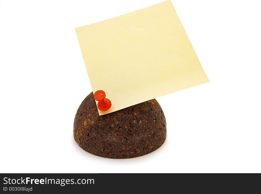 Cork sphere with pinned paper note on white background. Cork sphere with pinned paper note on white background