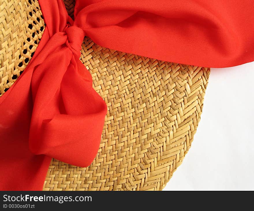 Straw hat with red bow on white background. Straw hat with red bow on white background