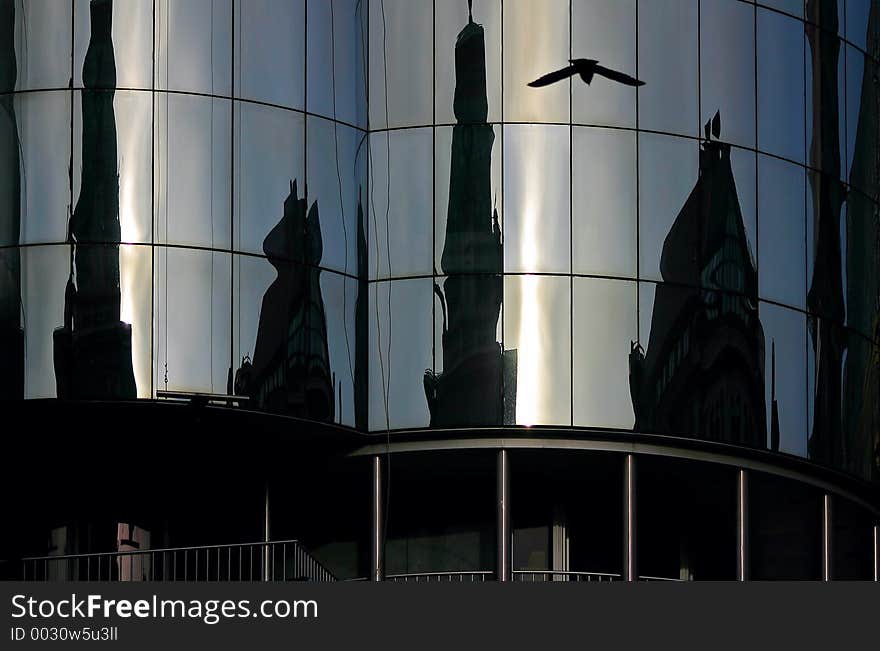 Mirror-Facade in vienna include a reflection of a bird. Mirror-Facade in vienna include a reflection of a bird