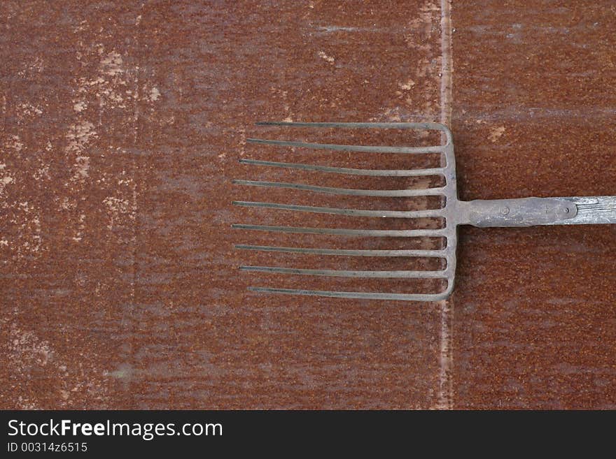 Old rusty hay-fork