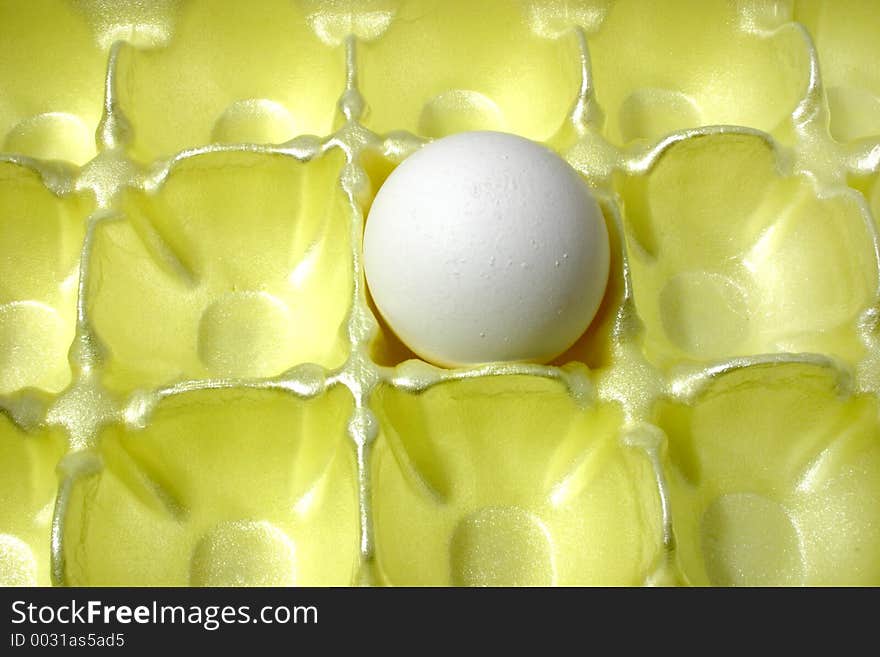 A single egg left in the carton. A single egg left in the carton.