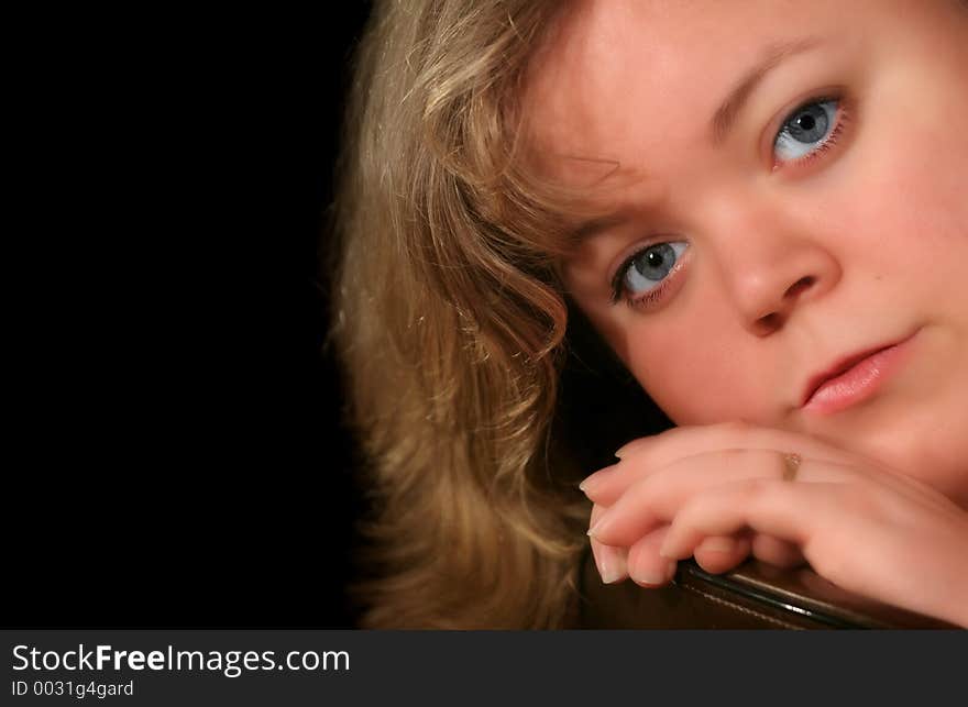 Young woman on black background