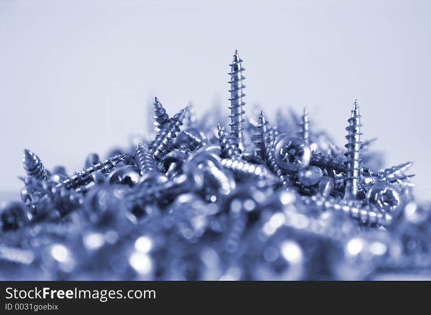 Close-up of pile of screws, selective focus