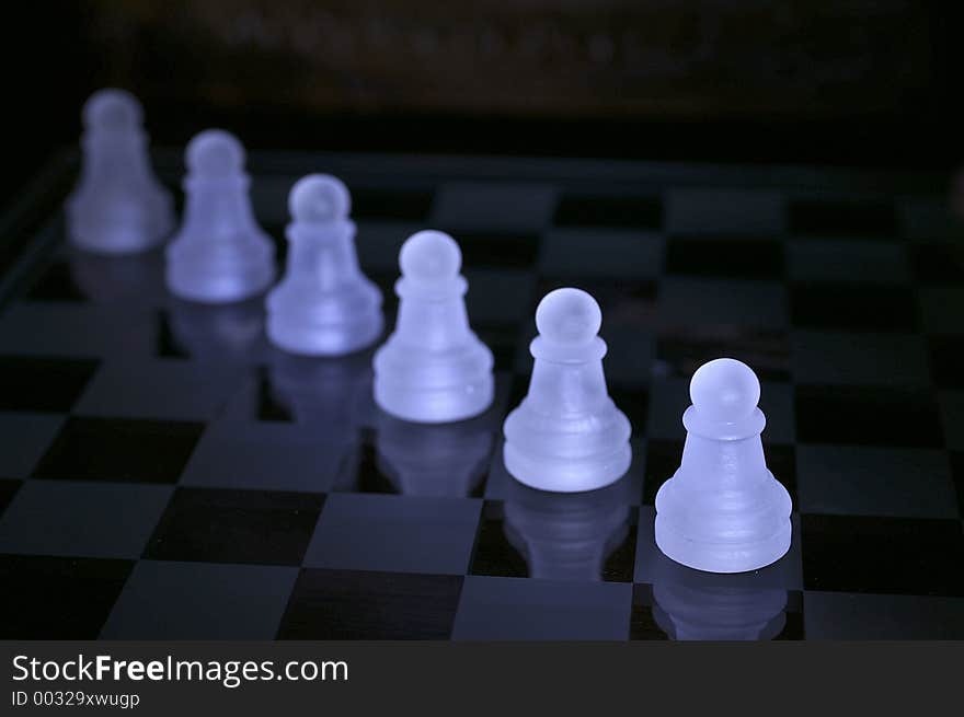 Chessmen at chessboard