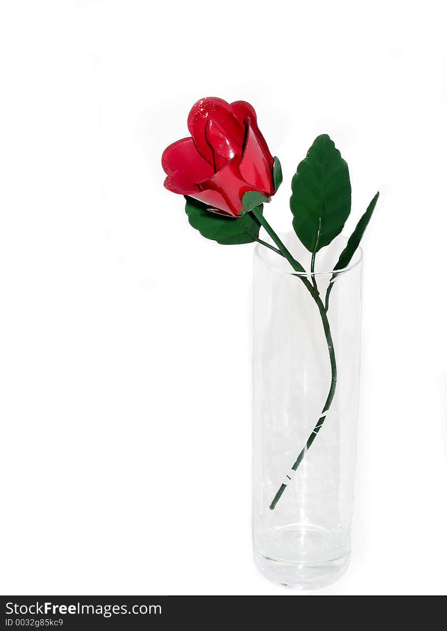 Metal red rose in etched glass vase. Metal red rose in etched glass vase