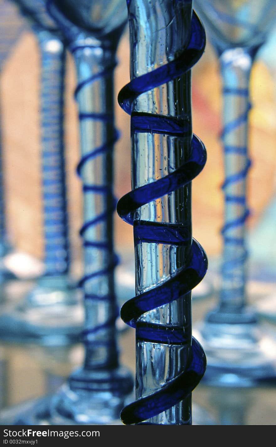 Blue glass Spiral on a wine glass stem. Blue glass Spiral on a wine glass stem