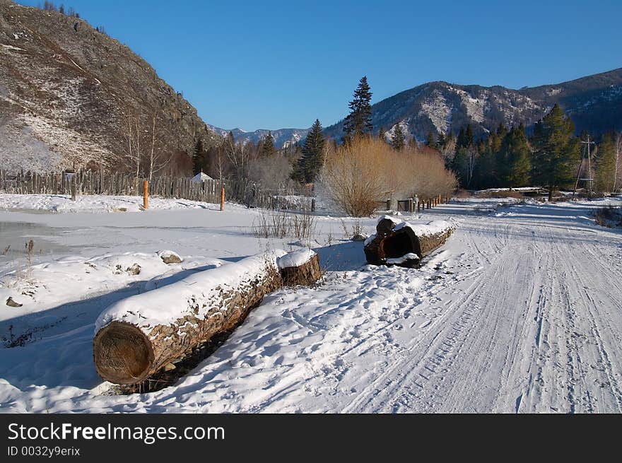 Winter road and logs