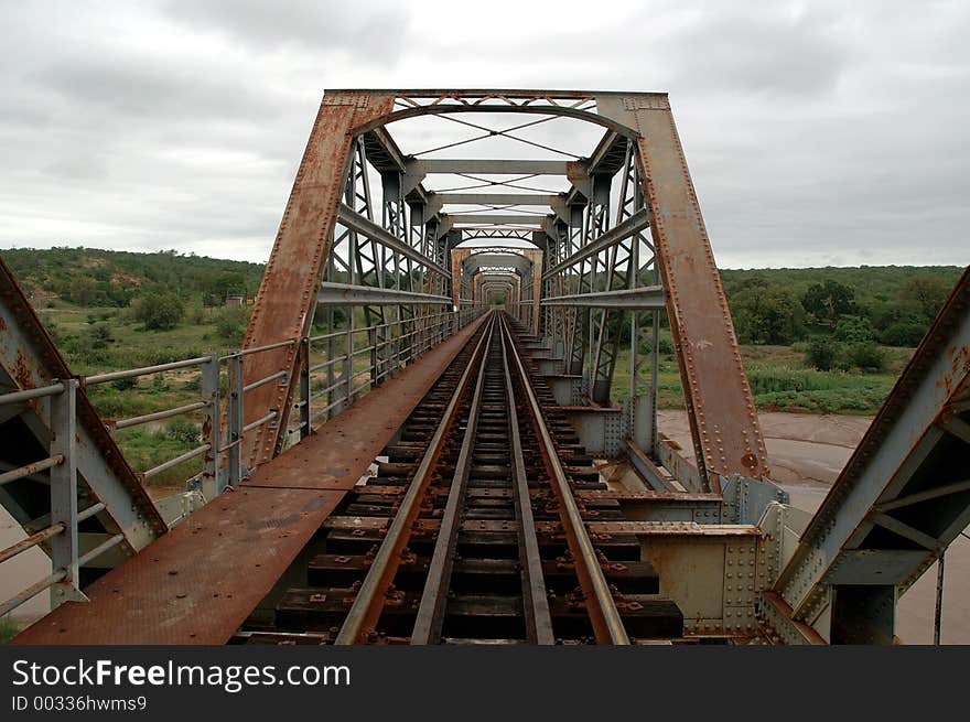 Old rusty train bridge. Old rusty train bridge