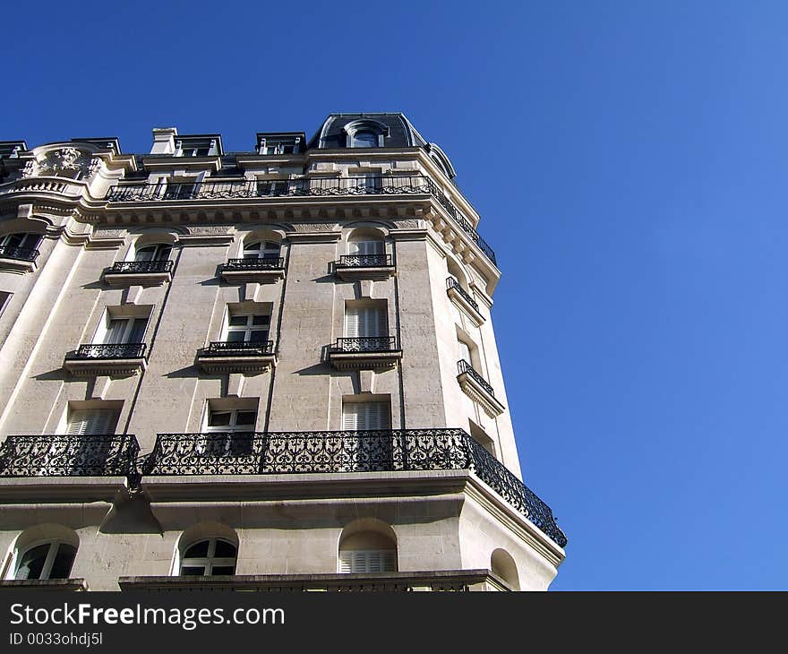 Traditional ancient building in Paris (France) on blue sky background. Traditional ancient building in Paris (France) on blue sky background