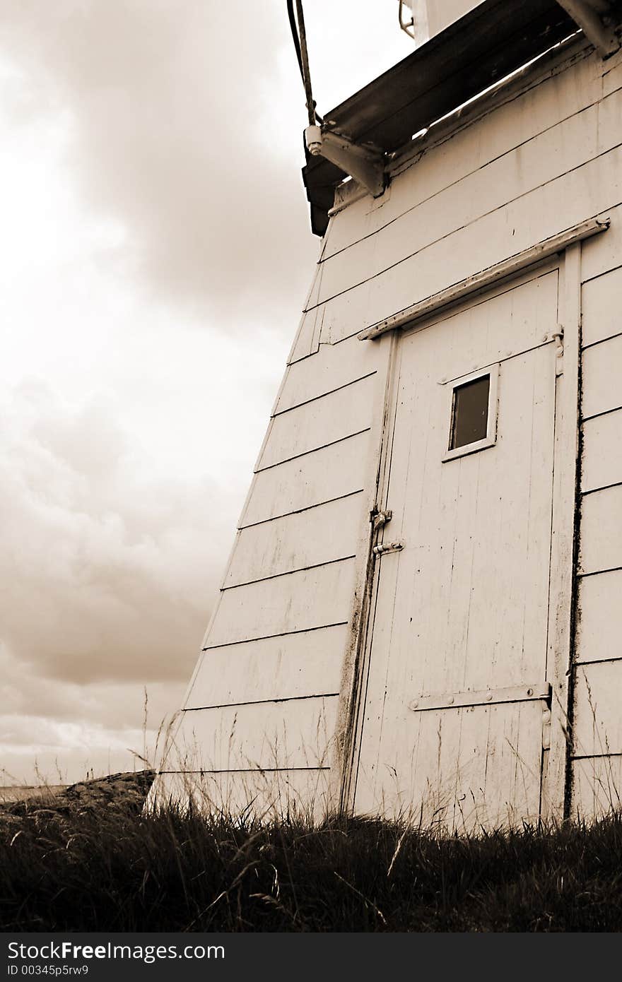 Lighthouse at the coast of Norway in sepia. Lighthouse at the coast of Norway in sepia