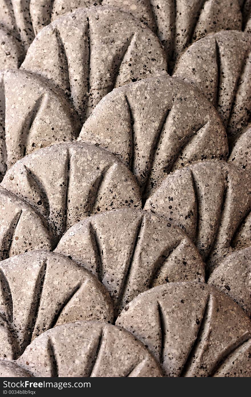 Patterns on a stone face which make up the pillar of a building. Patterns on a stone face which make up the pillar of a building