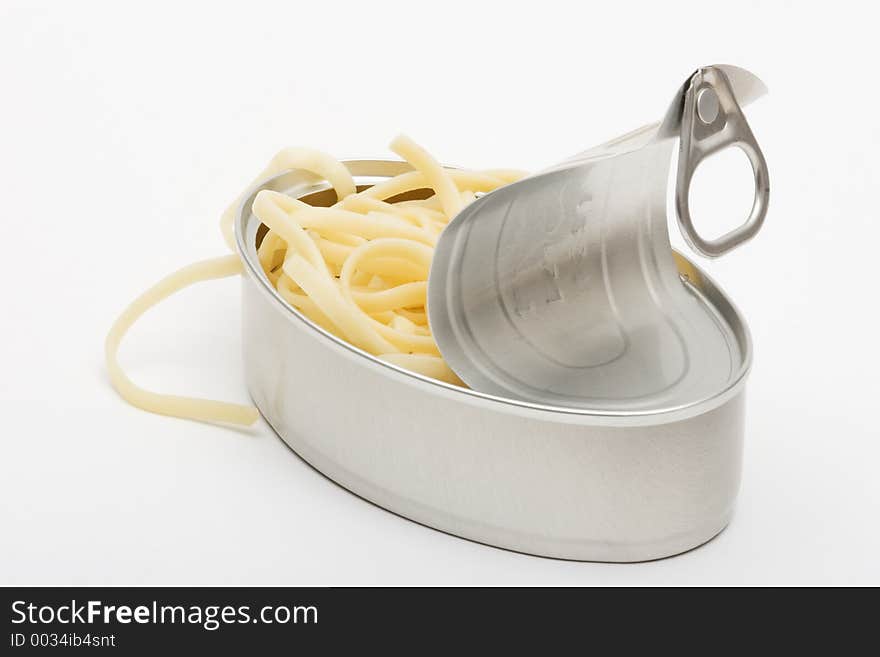 Cooked spaguetti in an open can. Cooked spaguetti in an open can