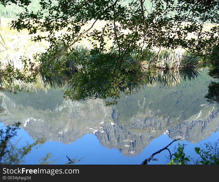 An effectful view on mountains thru a reflection on a place called Mirror Lakes on the southern Island of New Zealand. An effectful view on mountains thru a reflection on a place called Mirror Lakes on the southern Island of New Zealand