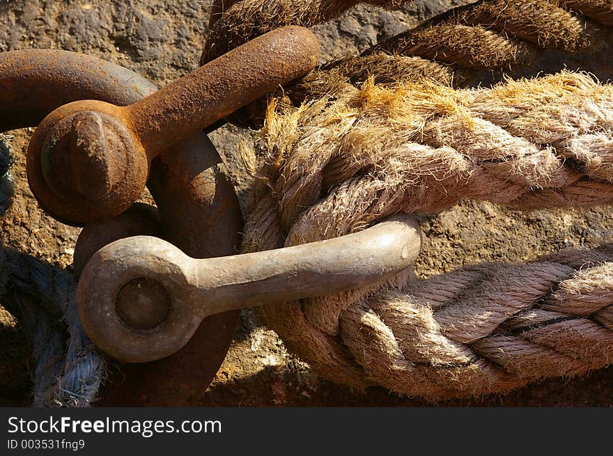 Ropes tieing up a ship to a mooring against the dock wall in Liverpool. Ropes tieing up a ship to a mooring against the dock wall in Liverpool.