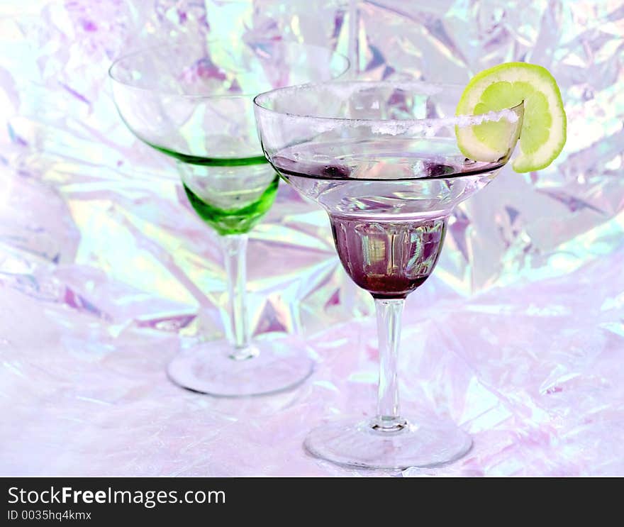 Margarita glasses on a shiny party background