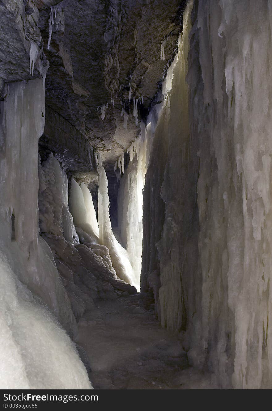 This inside or below the waterfalls. the ice melt wall on right hand was falls when there was warm weather. as it is currently frozen, there are nice ice tunnels behind the falls. (Jagala waterfalls, Estonia). This inside or below the waterfalls. the ice melt wall on right hand was falls when there was warm weather. as it is currently frozen, there are nice ice tunnels behind the falls. (Jagala waterfalls, Estonia)