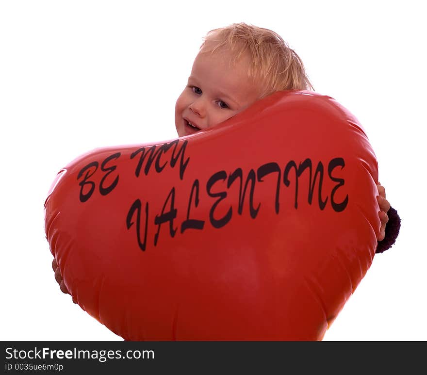 Little 2-year old holding a valentine heart. Little 2-year old holding a valentine heart.