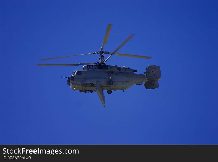 Military helicopter flying in the sky on MAKS 2005