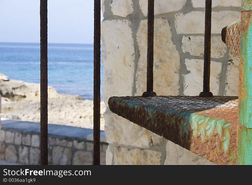 Ocean view through a set of spiral stairs. Ocean view through a set of spiral stairs