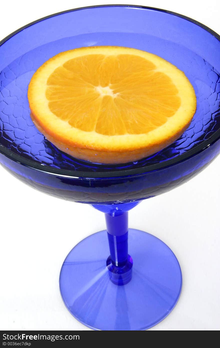 Half An Orange In Blue Glass