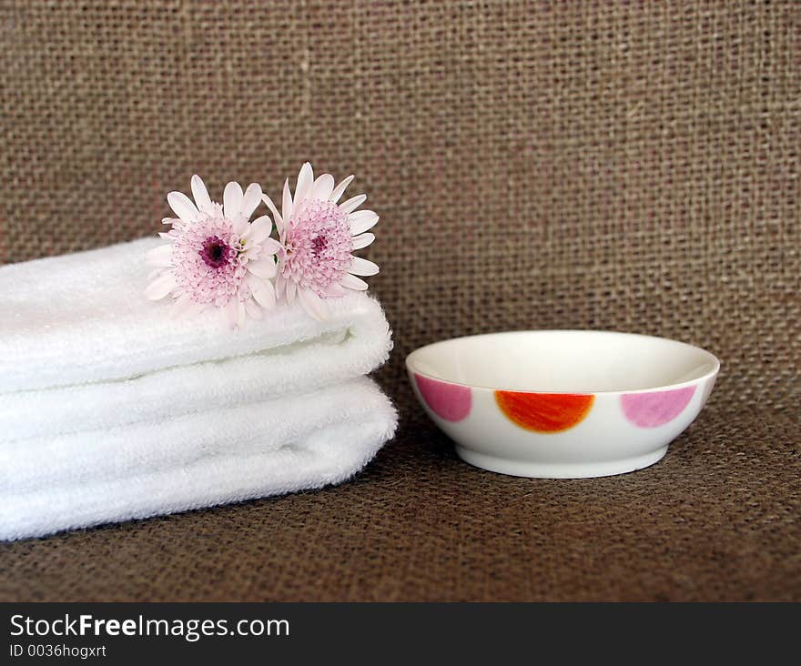 Two white towels and dish at a day spa