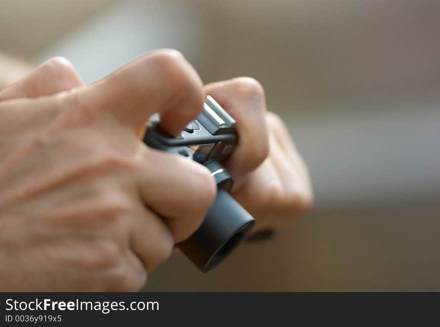 Hands holding camera closeup