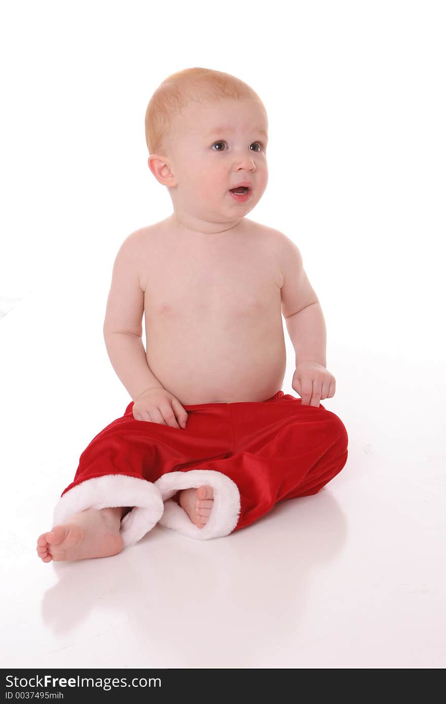 Santa kid sitting on floor. Santa kid sitting on floor