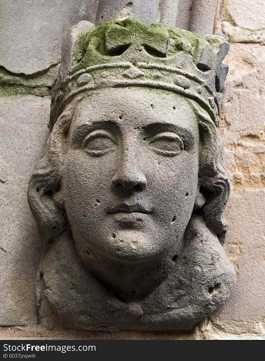 Carved head on ancient church in Birmingham, England. Carved head on ancient church in Birmingham, England