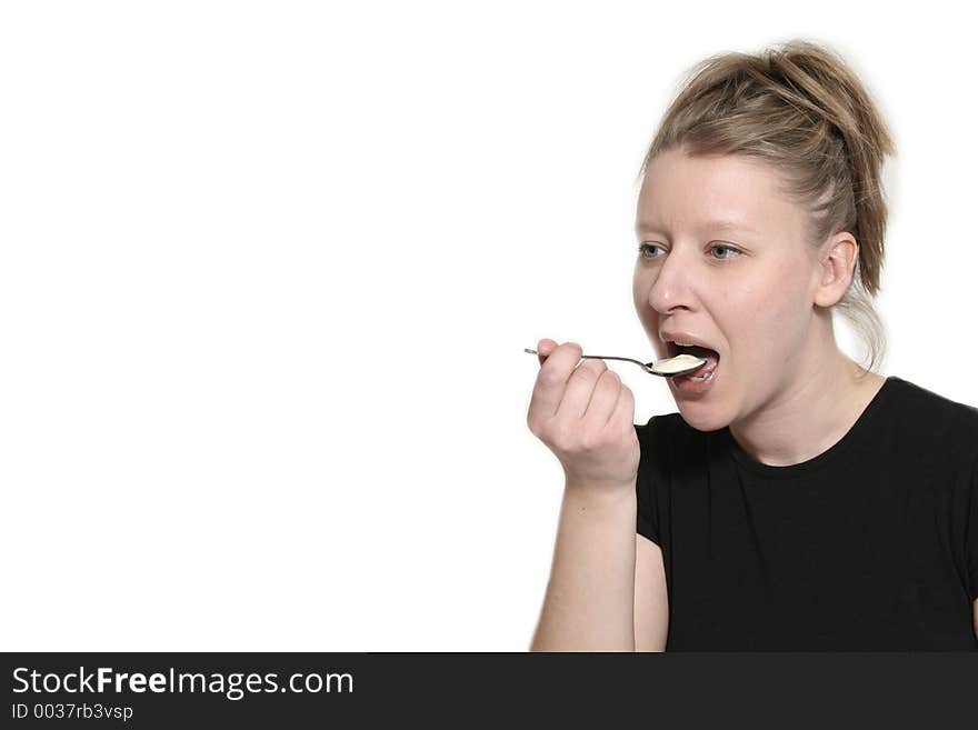 Woman eating with spoon. Woman eating with spoon