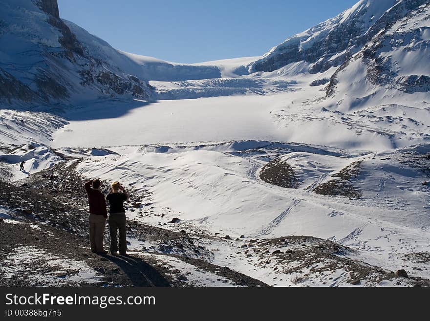 Tourists view the vast Columbia Icefields in Jasper National Park. Tourists view the vast Columbia Icefields in Jasper National Park.