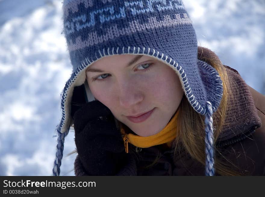 Portrait of a young girl talking on the phone