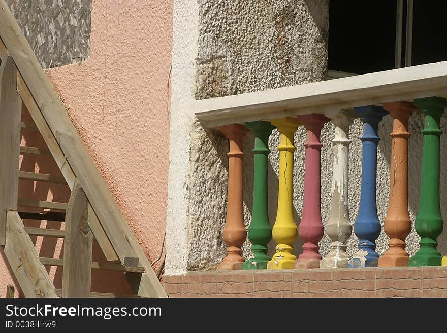 Section of a house featuring Colorful Porch Posts