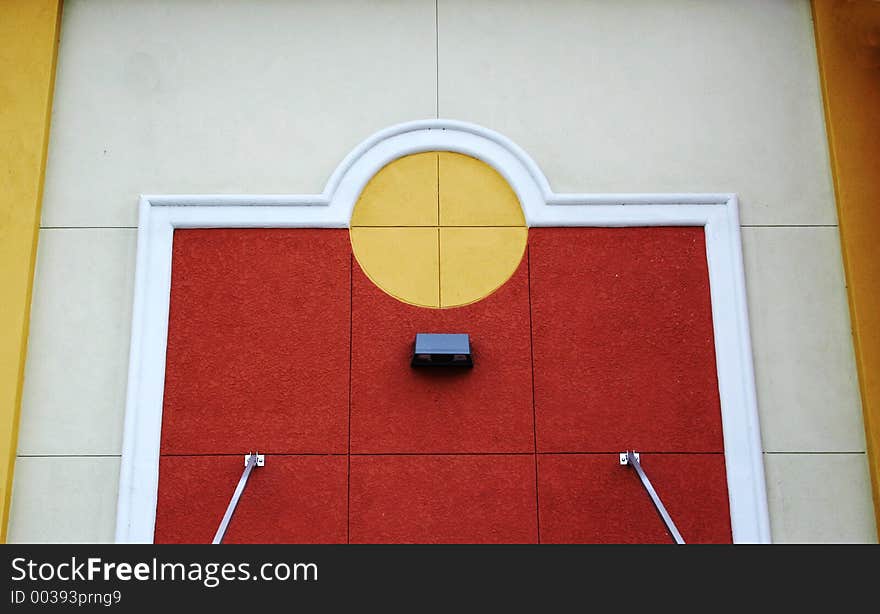 Colorful architectural details of wall of modern building, yellow,burnt sienna,white, cream,gold. Colorful architectural details of wall of modern building, yellow,burnt sienna,white, cream,gold