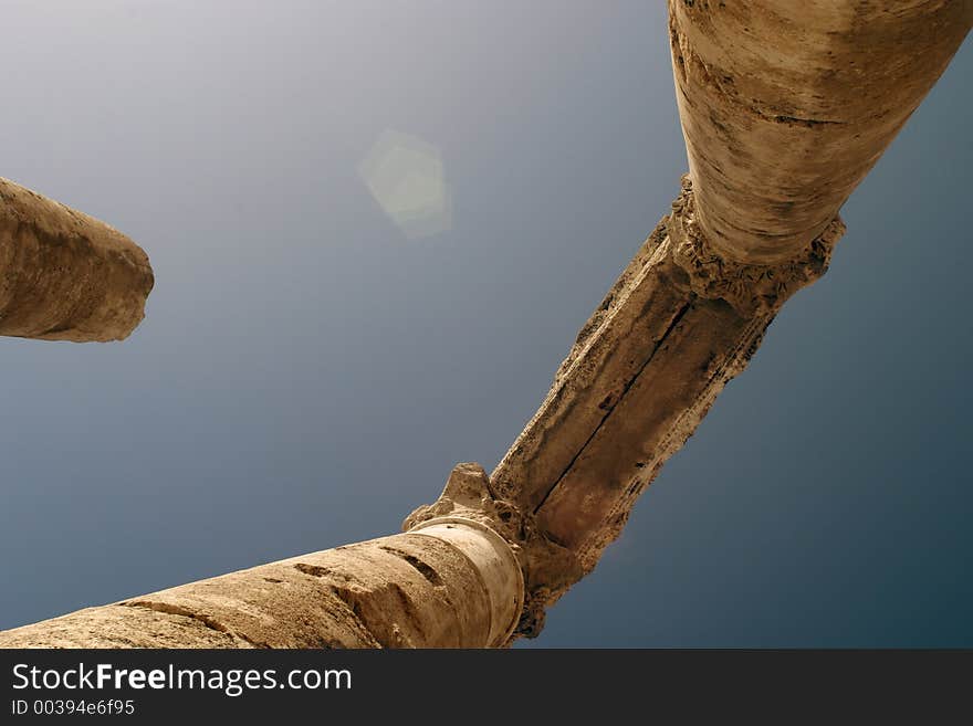 Ancient roman columns against a blue sky. Ancient roman columns against a blue sky