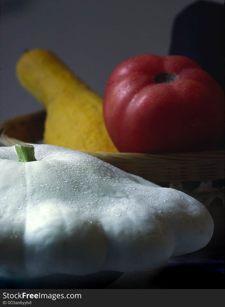 White squash, yellow squash and red tomato. White squash, yellow squash and red tomato