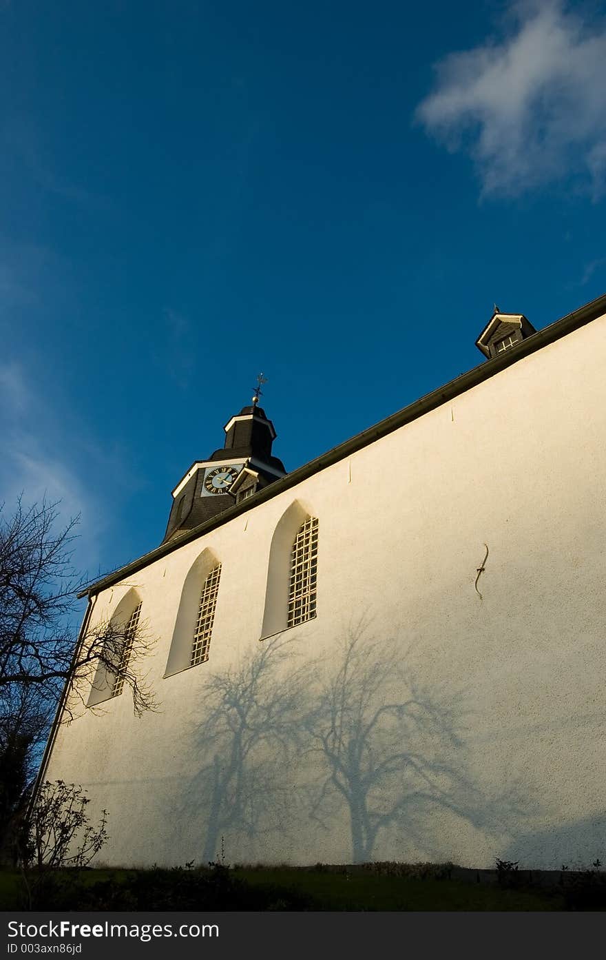 A church with shadow on the wall.