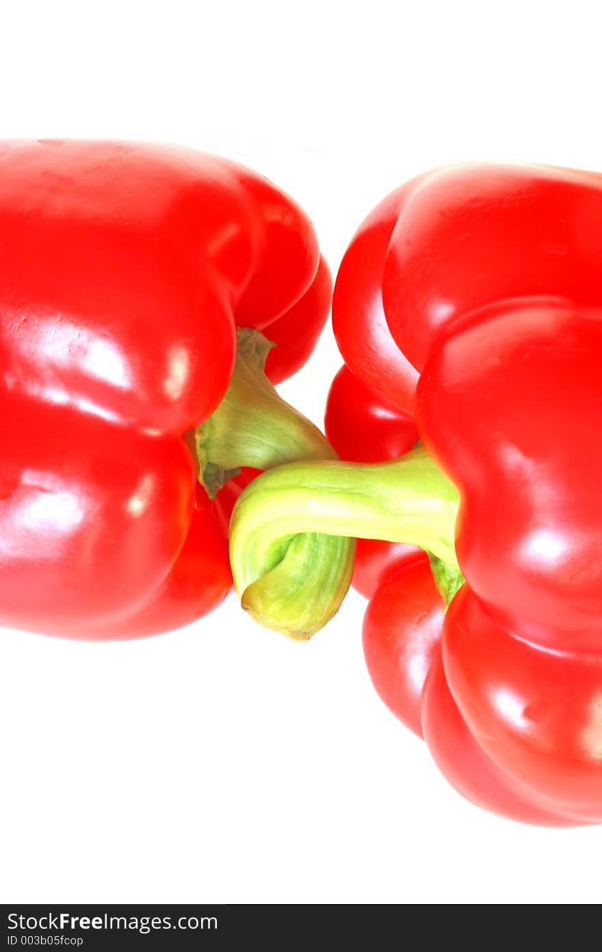 The Stems of Two Red Peppers are Linked. The Stems of Two Red Peppers are Linked.