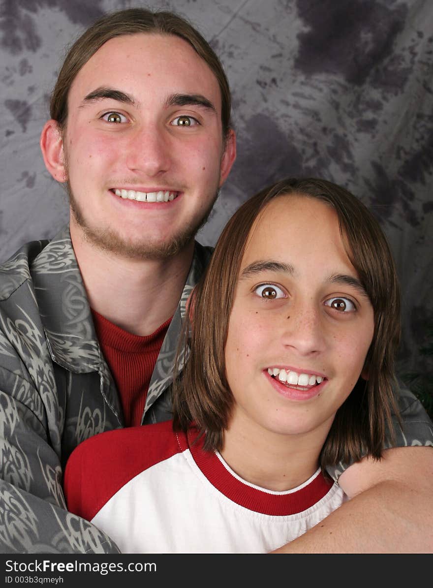 Two teen brothers with very wide eyed, humorous expressions. They look amazed, excited, stunned, or hypnotized. Two teen brothers with very wide eyed, humorous expressions. They look amazed, excited, stunned, or hypnotized.