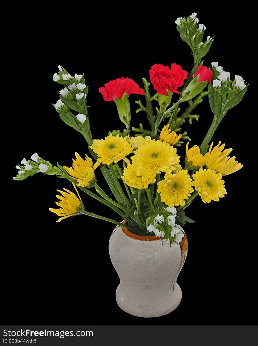 A welcome bouquet of flowers in a vase, isolated on black