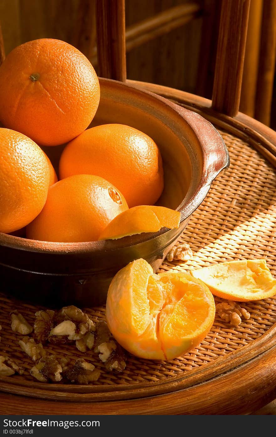 Low key image with oranges and walnuts. Low key image with oranges and walnuts