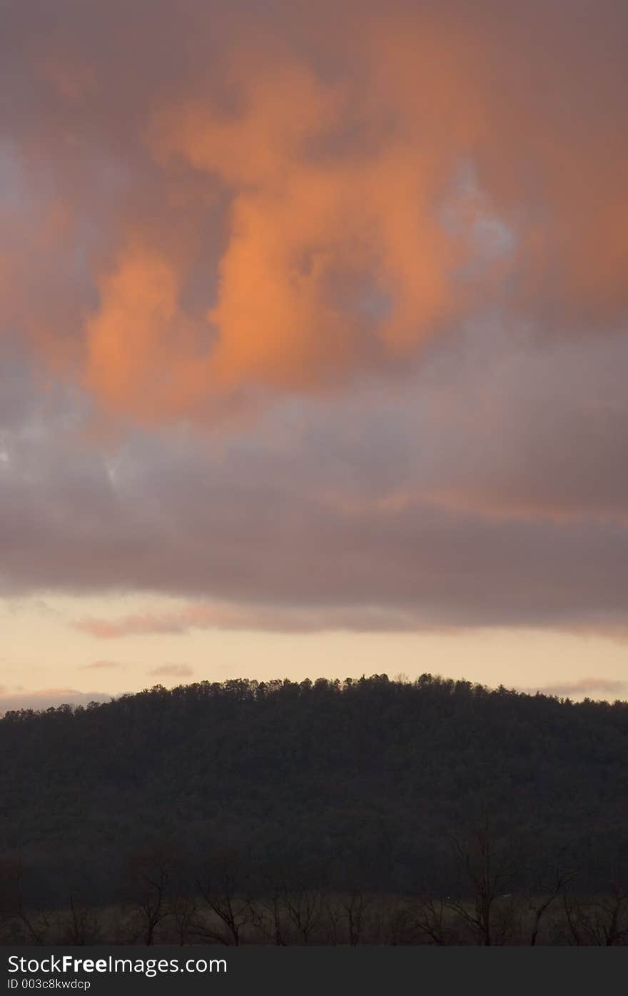 A storm moves over a hillside at sunset in Smoky Mountain National Park in Tennessee. A storm moves over a hillside at sunset in Smoky Mountain National Park in Tennessee