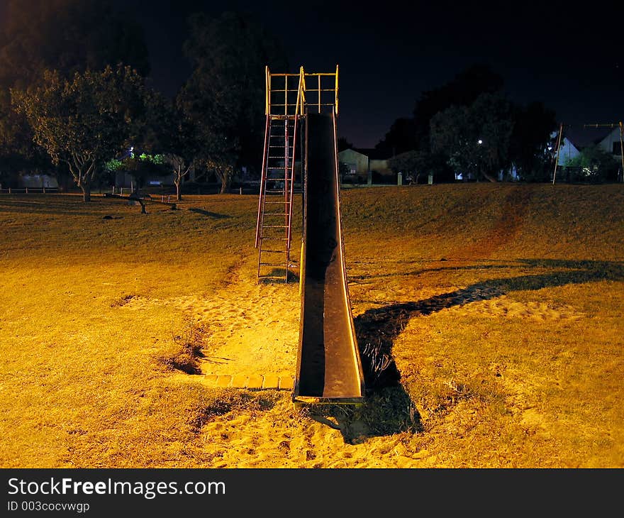 Urban park slide at night, front. Urban park slide at night, front.