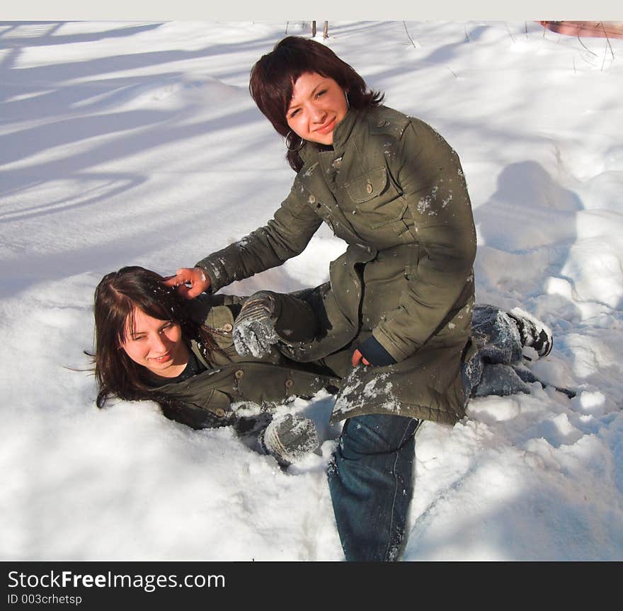 Girlfriends struggle in the snow. Girlfriends struggle in the snow