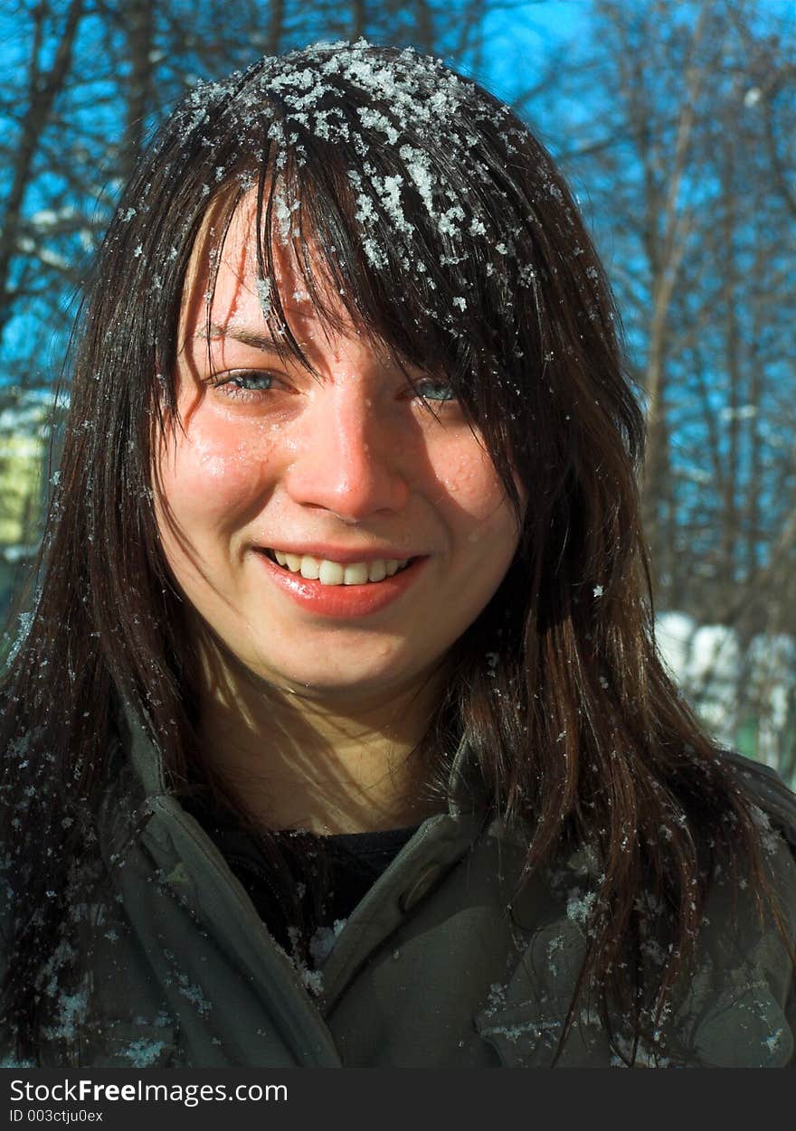 The girl with a snow on hair