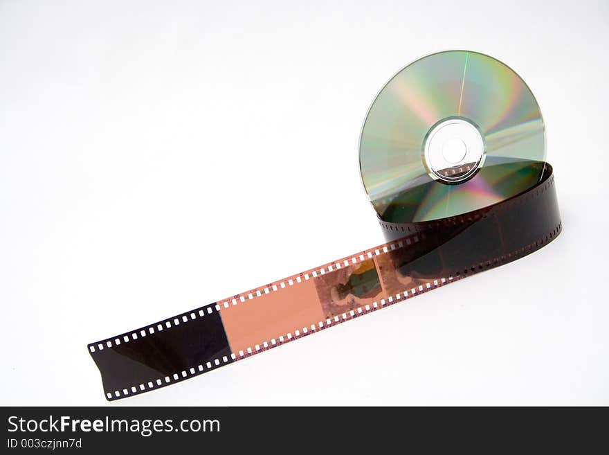 35 mm film and disk on white background. 35 mm film and disk on white background.